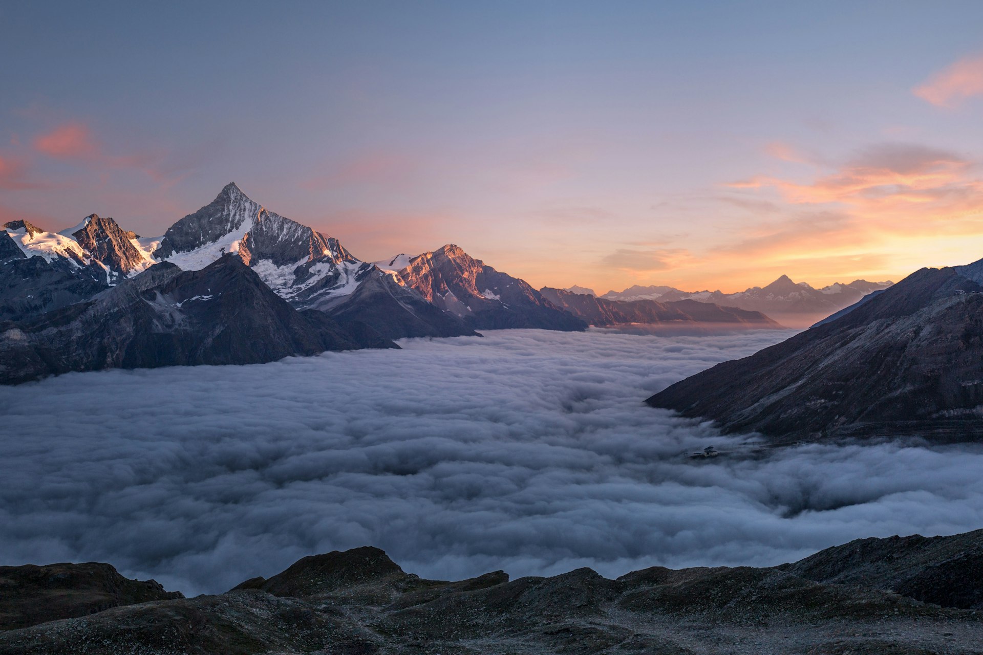 Mountain sunrise above the clouds